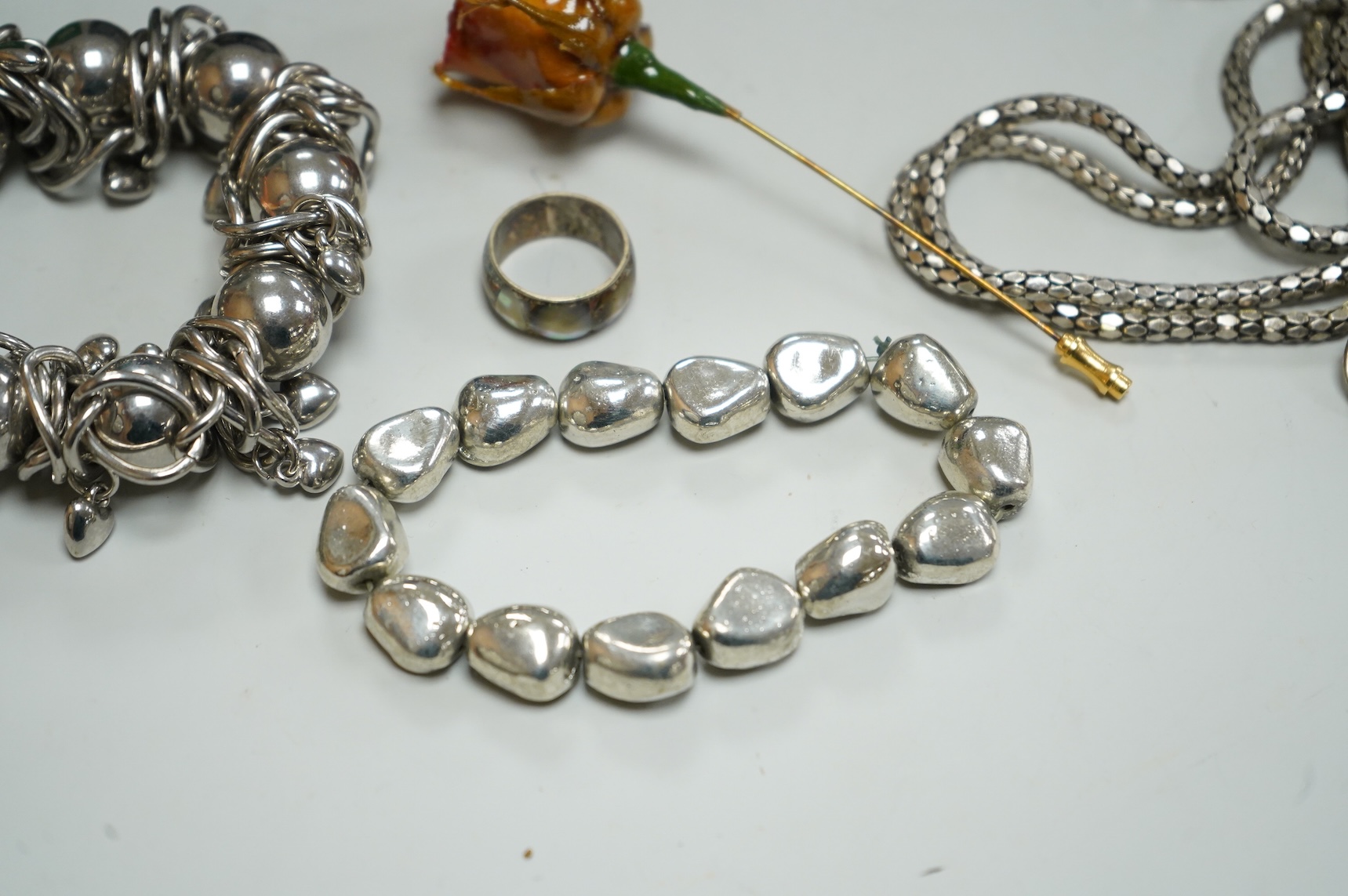 A collection of assorted costume jewellery, including a pair of spherical amethyst drop earrings, a modern silver mounted aide memoire, brooches, necklaces, rings et.